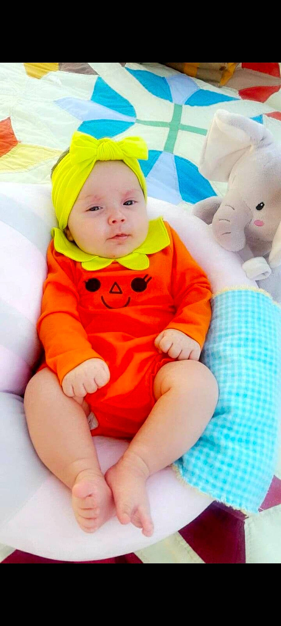 Raelee joined the competition — help win amazing prizes! baby, baby_products, child, headwear, orange, person, play, product, smile, stuffed_toy, toddler