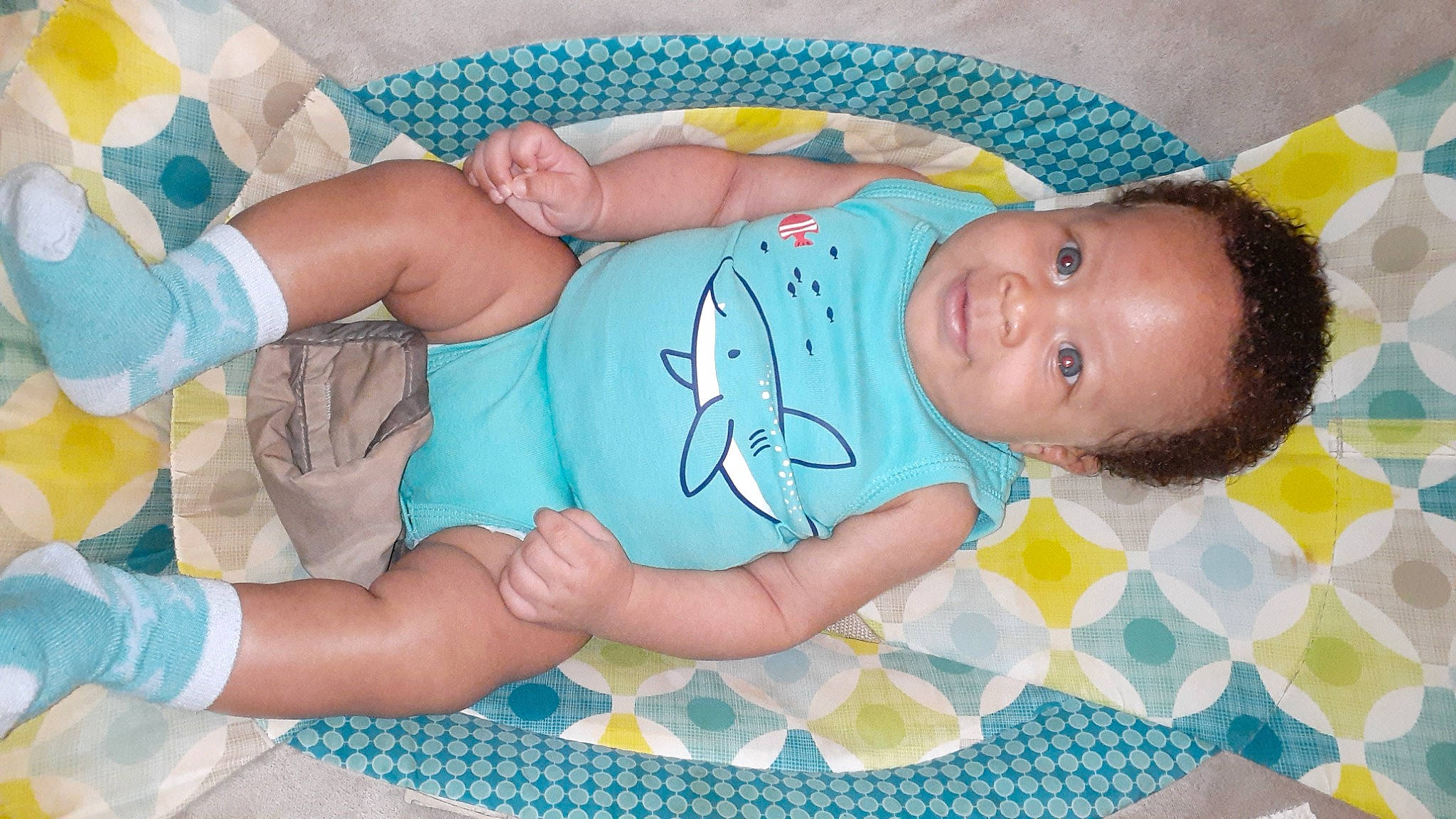 Bruce is registered to the contest to win money with this photo: aqua, baby, baby_products, baby_sleeping, baby_toddler_clothing, baby_toys, bedtime, blue, child, comfort, finger, happy, linens, pattern, person, play, room, skin, sleep, textile