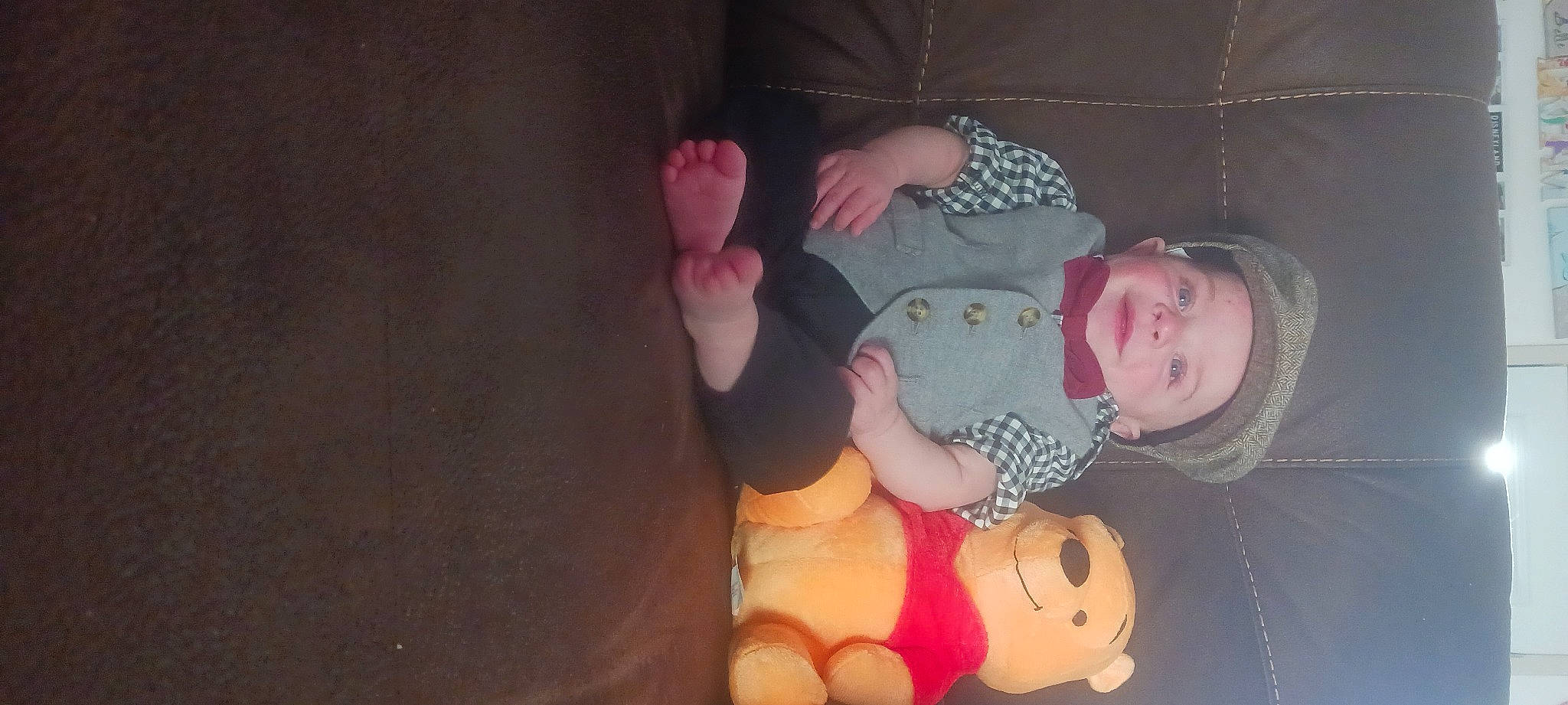 Lionel is registered to the contest to win money with this photo: baby, baby_products, baby_toddler_clothing, cheek, child, comfort, eye, finger, foot, fun, gesture, head, headwear, lap, person, room, sitting, skin, sleeve, thumb