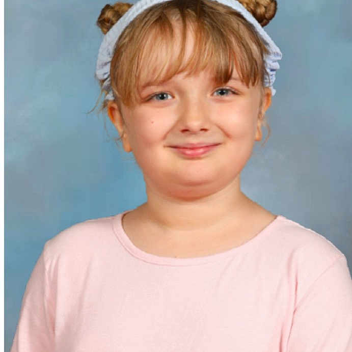 Julianne joined the competition — help win amazing prizes! blue_background, casual_clothing, child, childhood, cute, face, front_view, girl, hair_buns, happy, headband, innocent, light_hair, person, pink_shirt, portrait, smile, studio_photo, young, youth