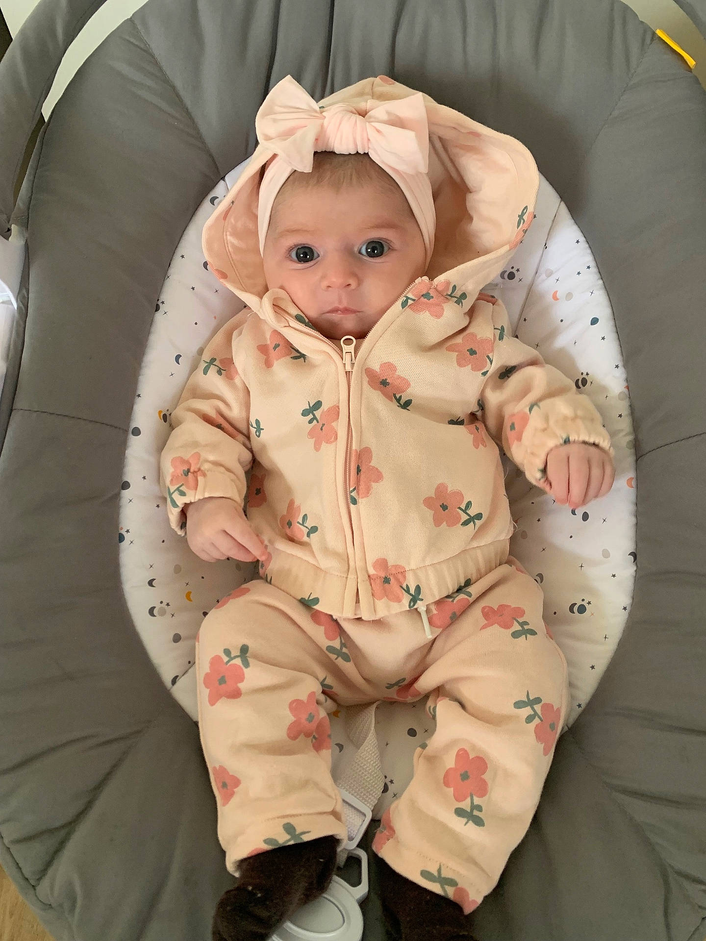 baby, blanket, bonnet, clothing, coat, crib, face, footwear, furniture, hat, head, hood, infantbed, jacket, pajamas, person, photography, portrait, shoe, sleeve