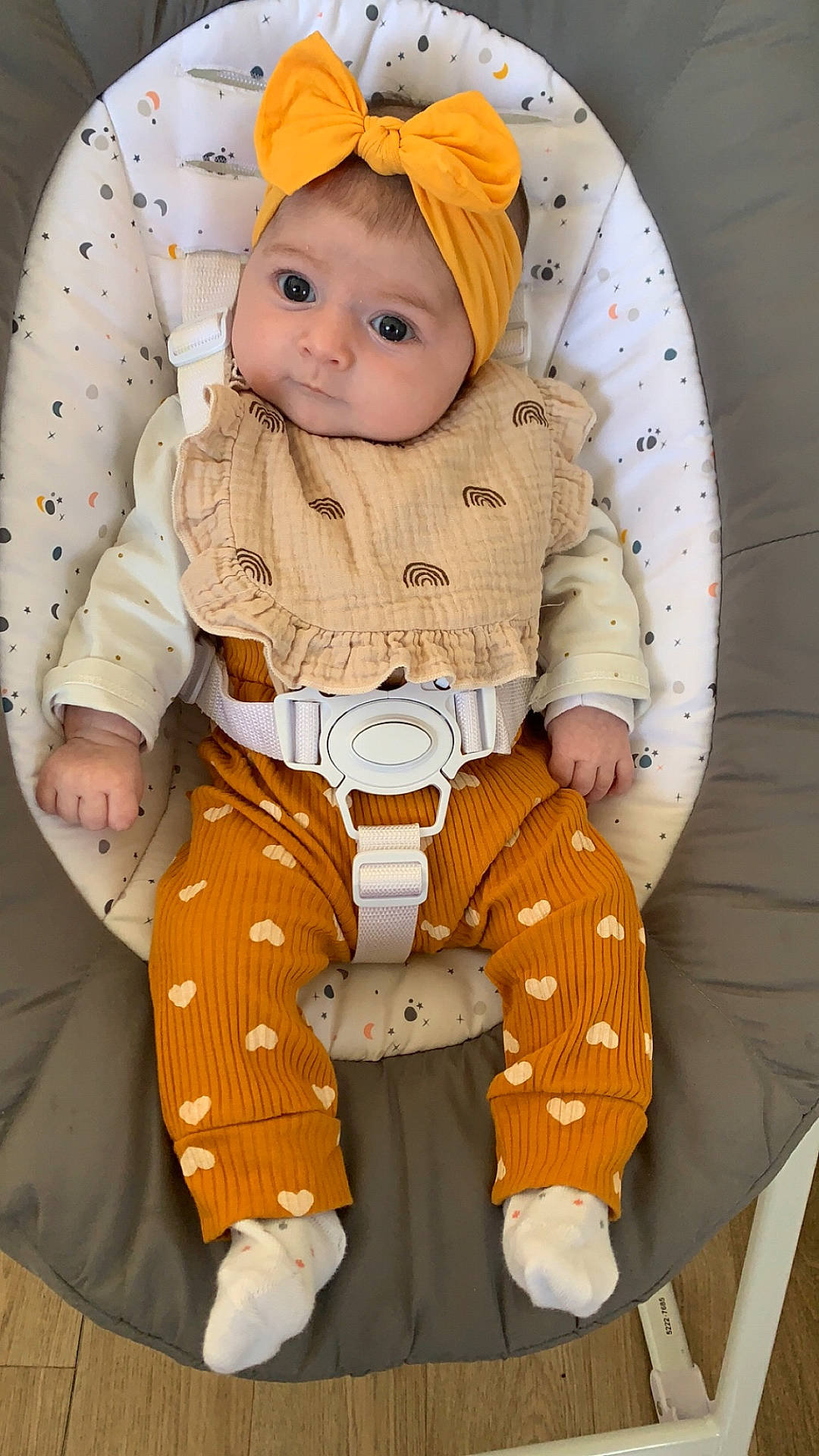 baby, bed, cap, clothing, crib, face, furniture, happy, hat, head, hosiery, infantbed, knitwear, pants, person, photography, portrait, smile, sock, sweater