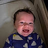 Lucas is registered to the contest to win money with this photo: baby, infant, child, smiling, happy, face, portrait, indoor, bassinet, crib, blanket, pajamas, cloud_pattern, sleepwear, lying_down, cozy, head, hair, eyes, photograph