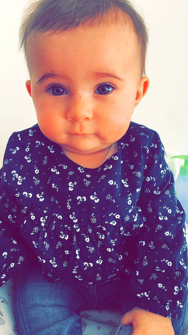 Elsa participe au concours pour gagner de l'argent avec cette photo : baby, blue, cheek, child, chin, eye, eyebrow, face, forehead, head, iris, lip, neck, nose, outerwear, person, pink, purple, skin, smile