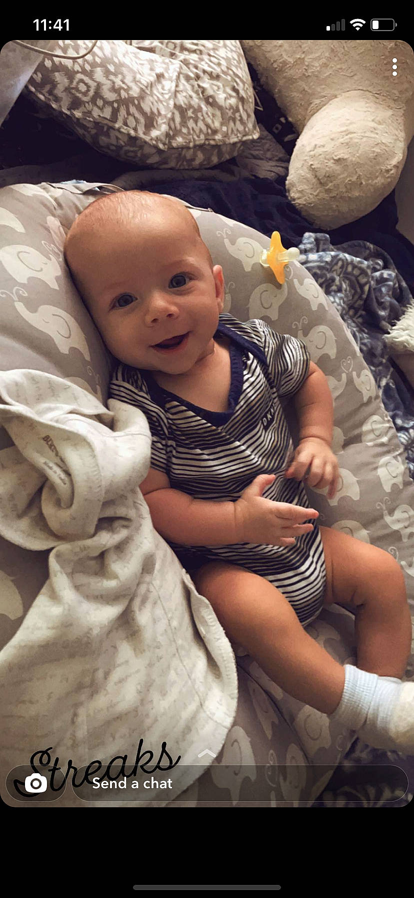 Xavier Bennett is registered to the contest to win money with this photo: baby, baby_toddler_clothing, cheek, child, comfort, dress, foot, fun, grass, hairstyle, happy, human_leg, linens, person, sandal, sitting, skin, smile, textile, thigh