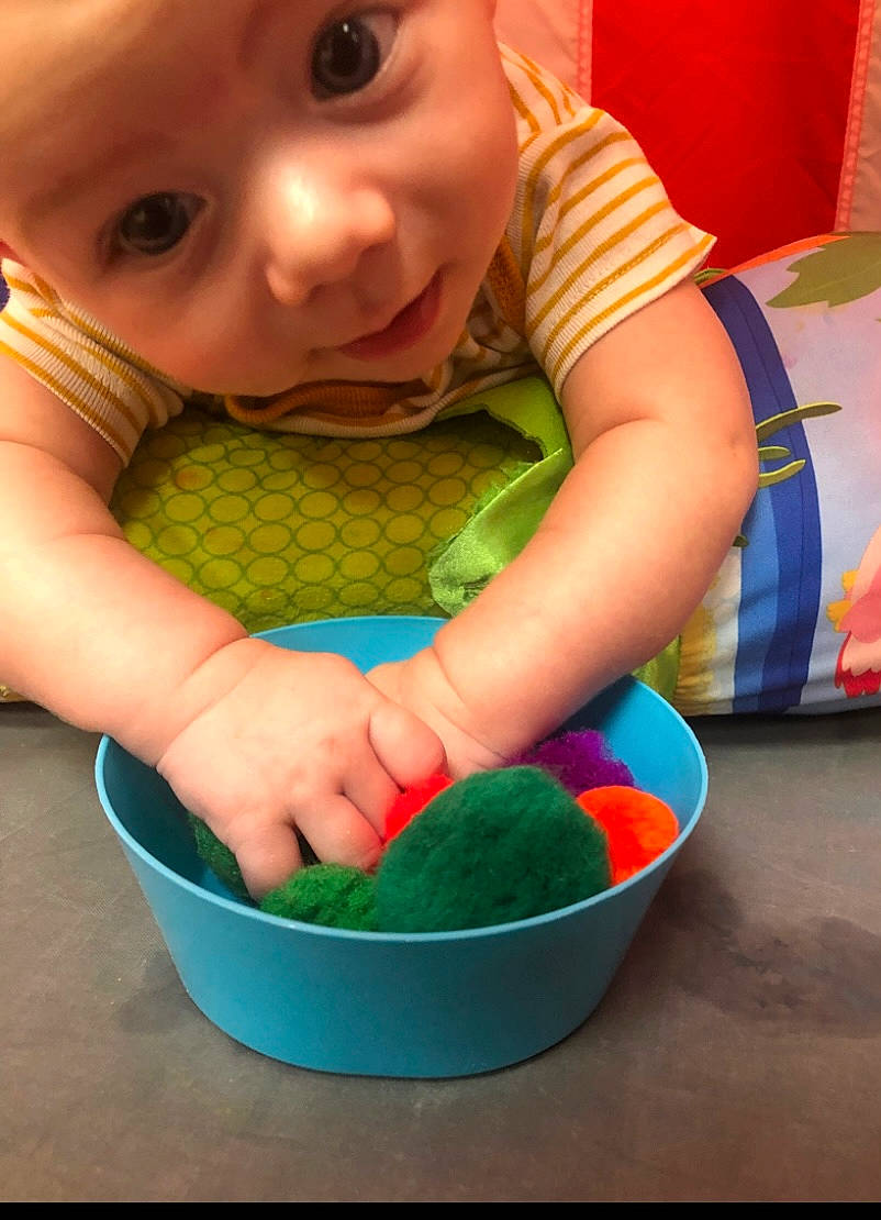Xavier Bennett is registered to the contest to win money with this photo: baby, baby_toddler_clothing, cheek, child, finger, fun, green, hand, happy, headwear, human_body, iris, mouth, nose, pattern, person, product, skin, sleeve, smile