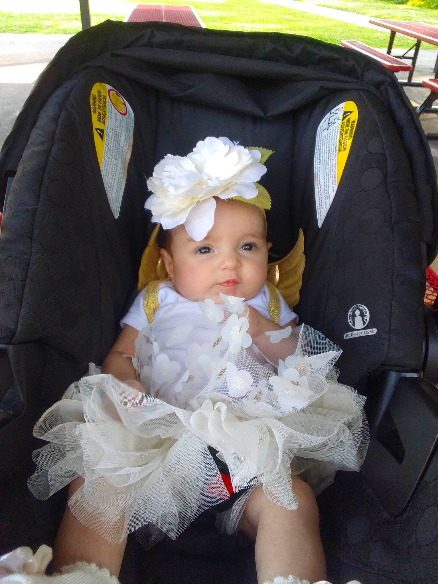 Patience joined the competition — help win amazing prizes! baby, baby_carriage, baby_products, baby_toddler_clothing, black, child, costume_hat, dress, embellishment, event, fashion_accessory, hair_accessory, hat, headband, headpiece, headwear, jewellery, person, petal, pink