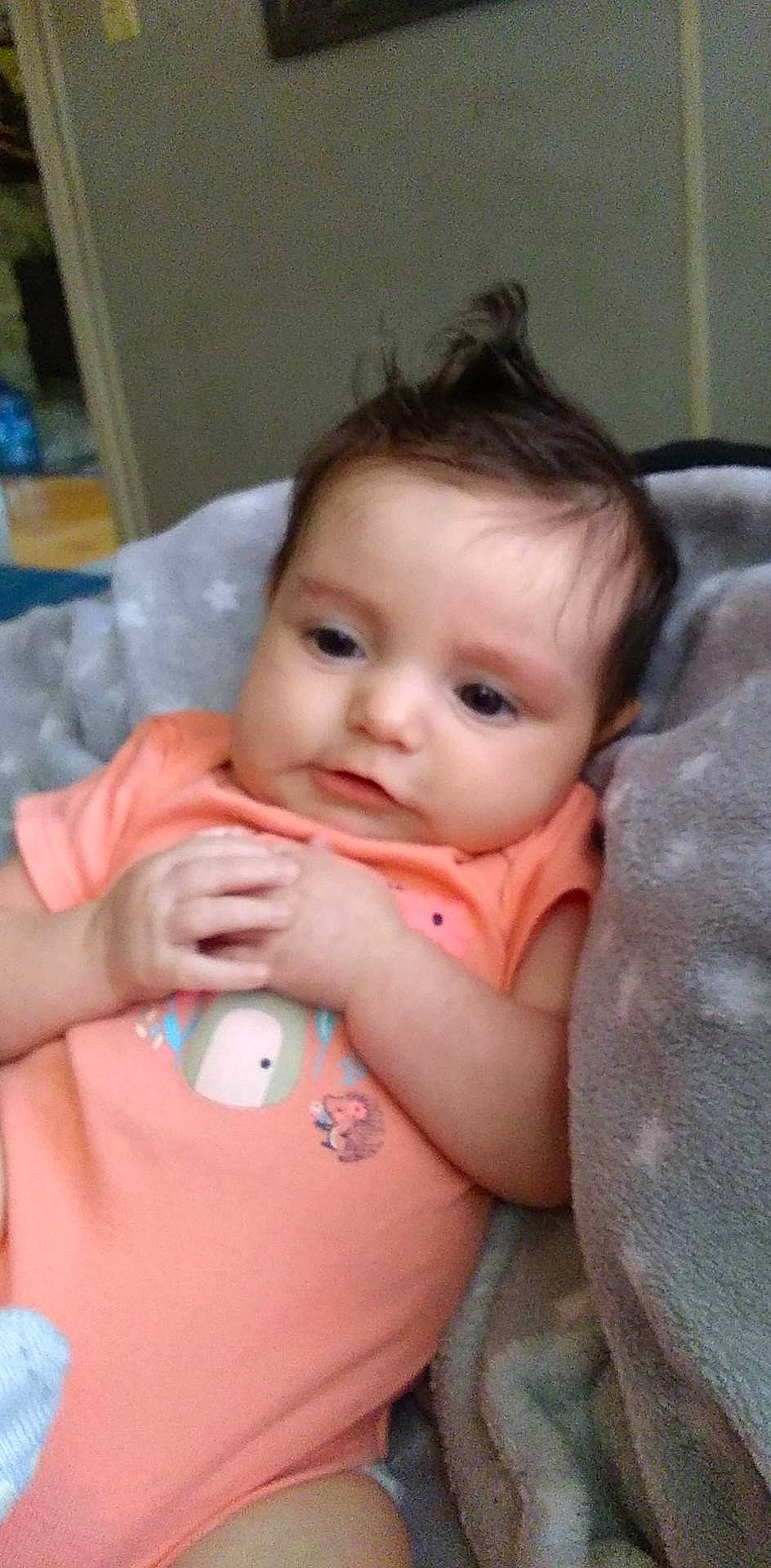 Patience is registered to the contest to win money with this photo: baby, baby_toddler_clothing, cheek, chest, chin, eye, eyebrow, eyelash, gesture, head, human_body, iris, lip, mouth, neck, nose, person, shoulder, skin, thumb