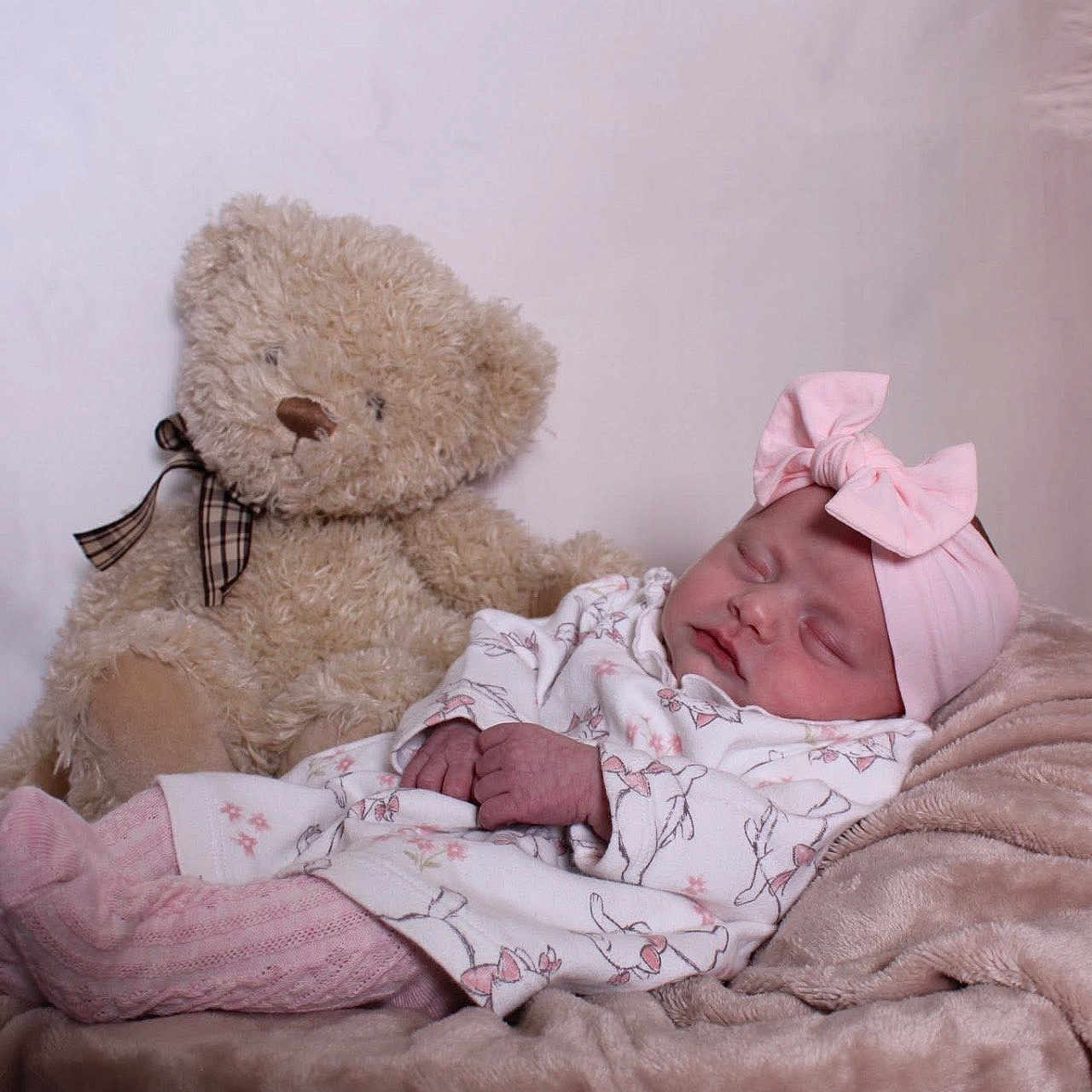 Ohana-Mae joined the competition — help win amazing prizes! adorable, baby, blanket, child, comfort, cozy, cute, headband, indoor, infant, peaceful, pink, plush, portrait, resting, sleeping, small, soft_toys, teddy_bear, white_clothing