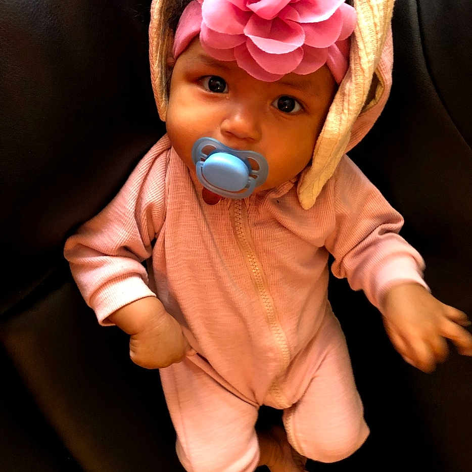 Beloved is registered to the contest to win money with this photo: baby, bonnet, cap, clothing, coat, couch, cushion, face, flower, furniture, hat, head, homedecor, hood, person, photography, plant, portrait, rose, toy
