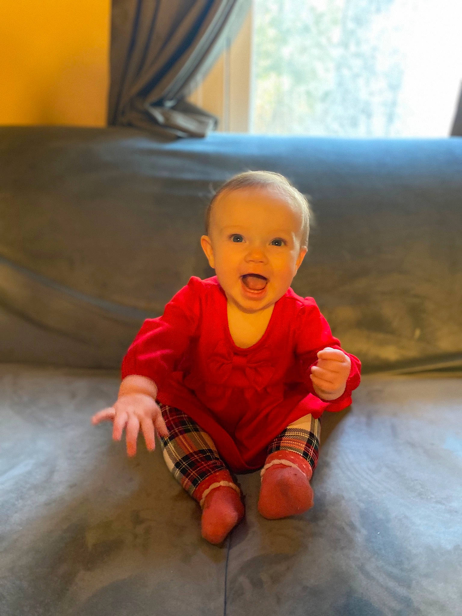 Isabella Rose is registered to the contest to win money with this photo: baby, baby_toddler_clothing, cheek, child, comfort, floor, flooring, foot, fun, happy, hardwood, head, person, room, sitting, sleeve, smile, t_shirt, tints_and_shades, toddler