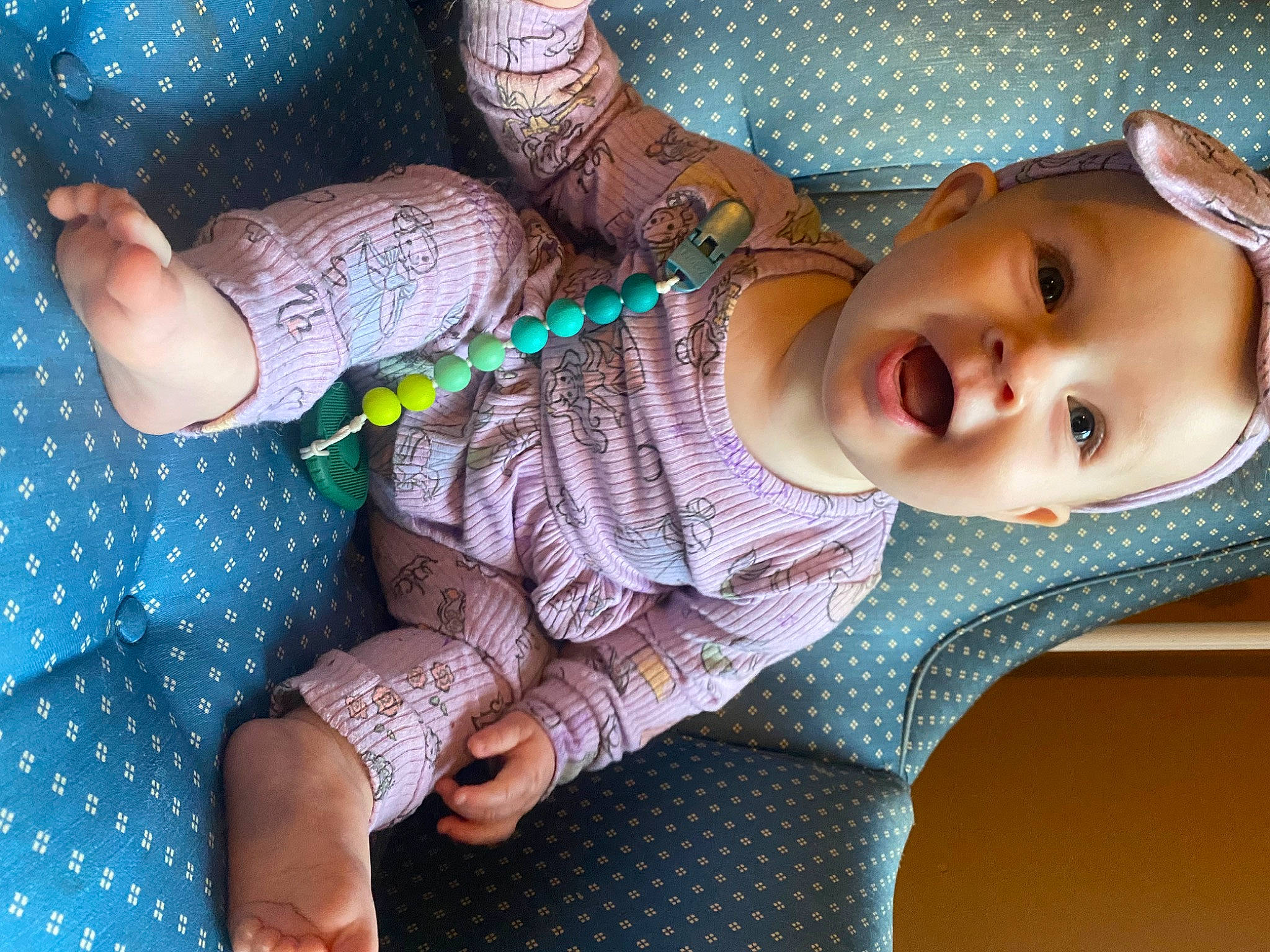 Isabella Rose is registered to the contest to win money with this photo: baby, baby_toddler_clothing, beauty, cheek, chest, comfort, eyelash, finger, hand, human_body, leg, lip, mouth, pattern, person, skin, sleeve, thigh, thumb, toddler