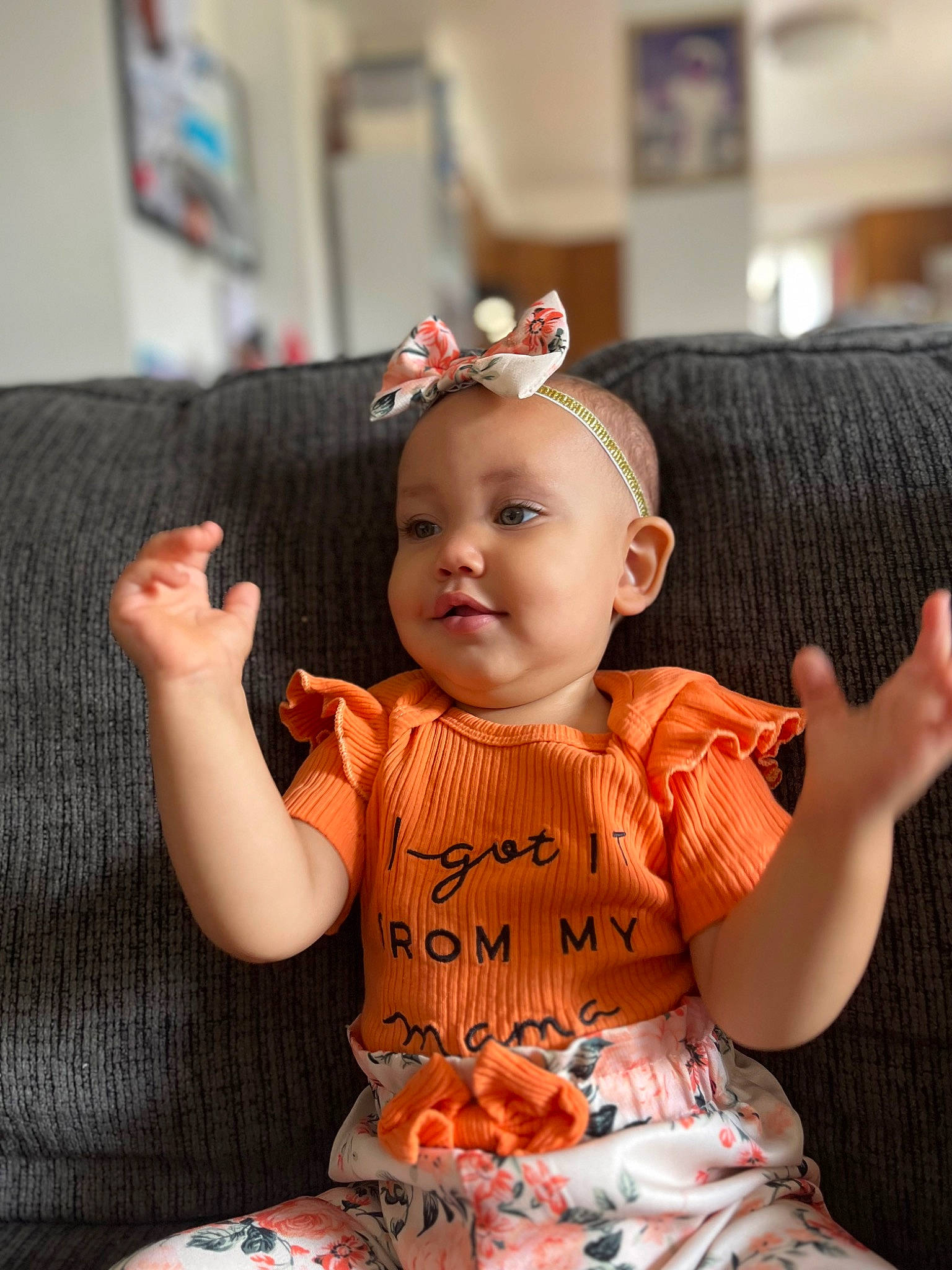 Savaile is registered to the contest to win money with this photo: arm, baby, baby_toddler_clothing, black_hair, cake, cake_decorating, cheek, dress, eyelash, finger, hairstyle, hand, happy, human_body, orange, person, pink, skin, sleeve, sugar_cake