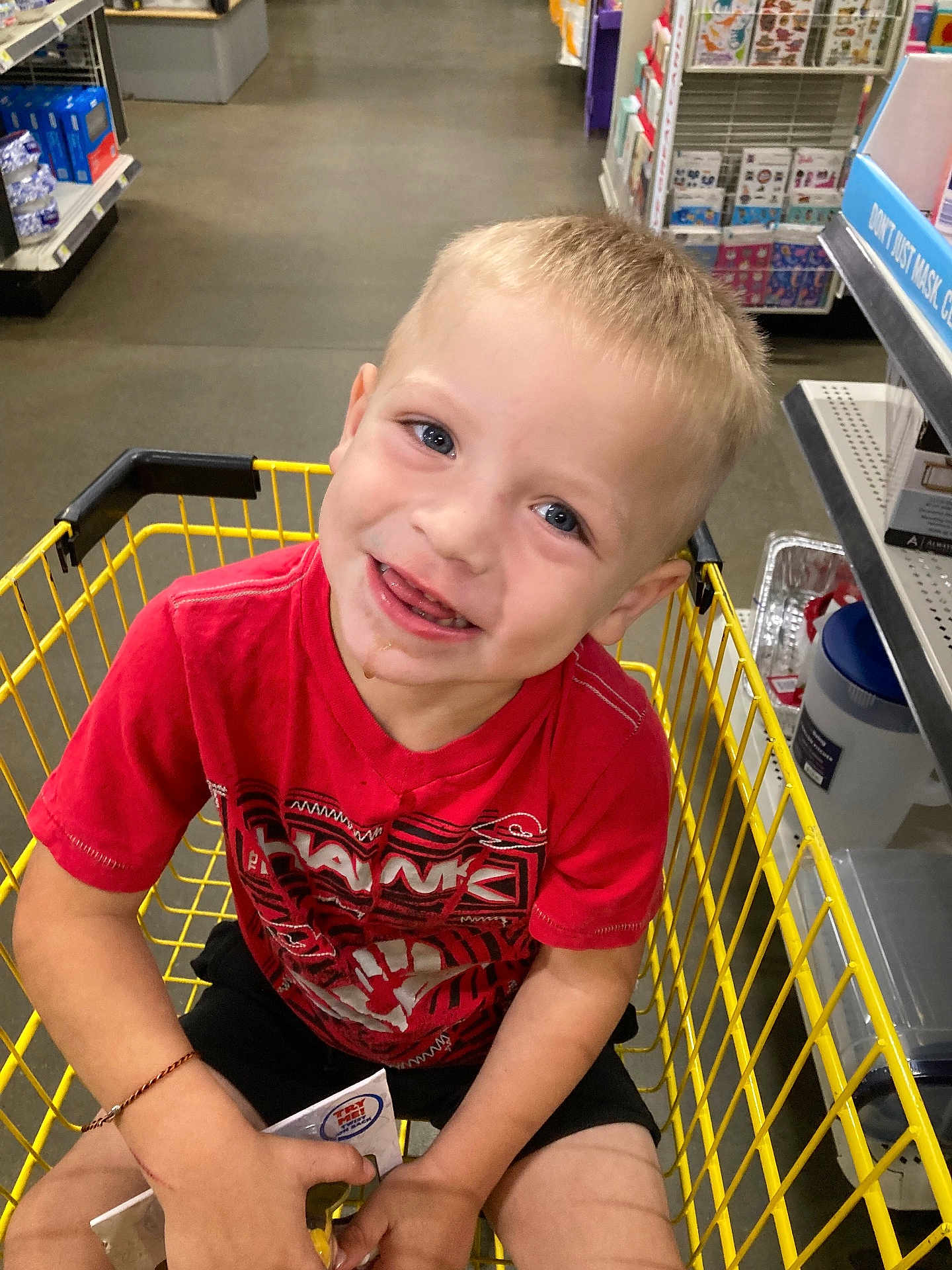 Brayden joined the competition — help win amazing prizes! child, boy, shopping_cart, red_shirt, smiling, blue_eyes, toy_package, store_aisle, shopping, yellow_cart, shorts, casual_clothing, happy, portrait, retail, floor, shelves, product_display, indoor, cute