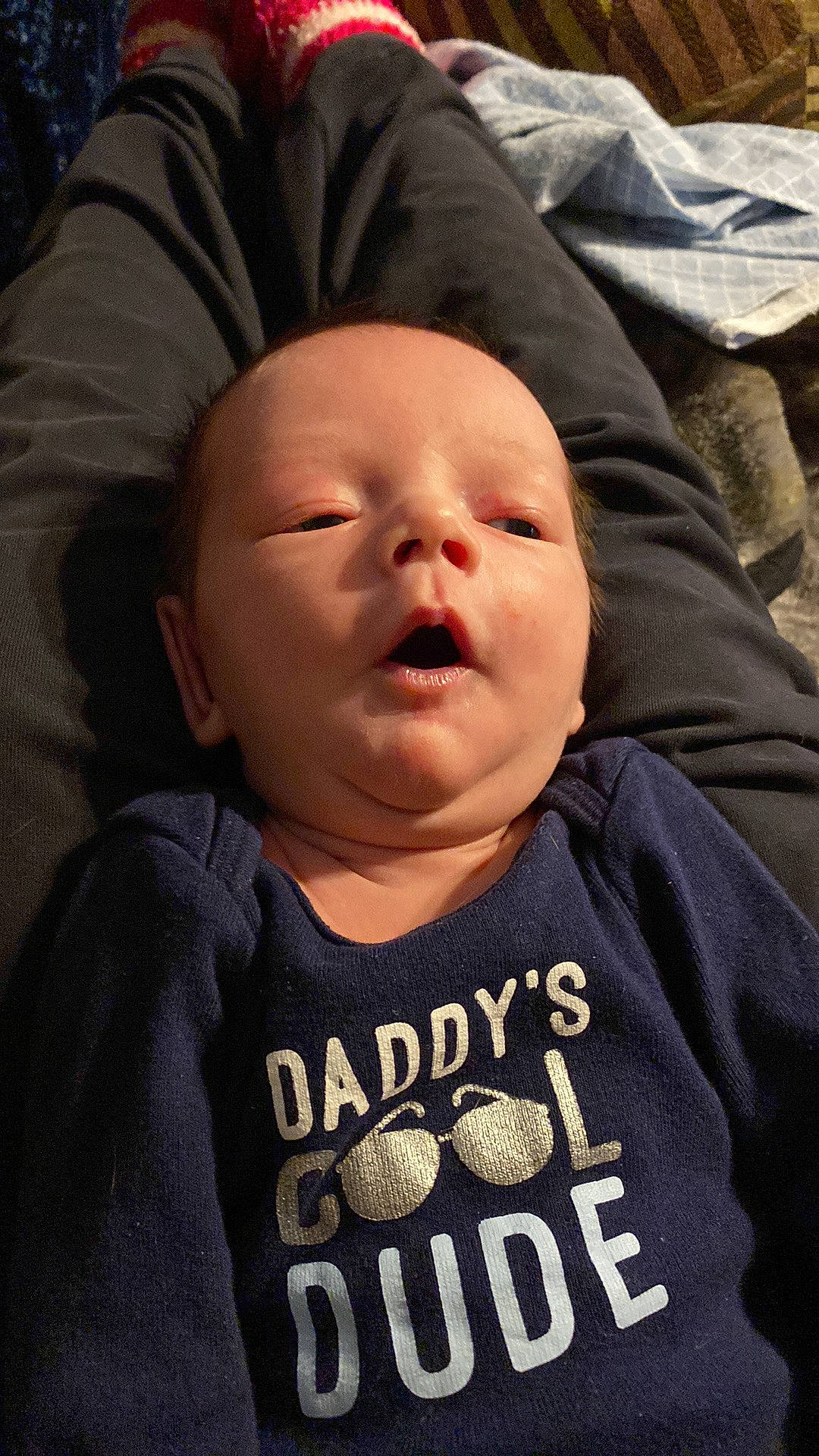 Phoenix is registered to the contest to win money with this photo: baby, baby_toddler_clothing, cheek, child, chin, comfort, cool, facial_expression, font, forehead, happy, mammal, mouth, nose, outerwear, person, sleeve, smile, t_shirt, textile