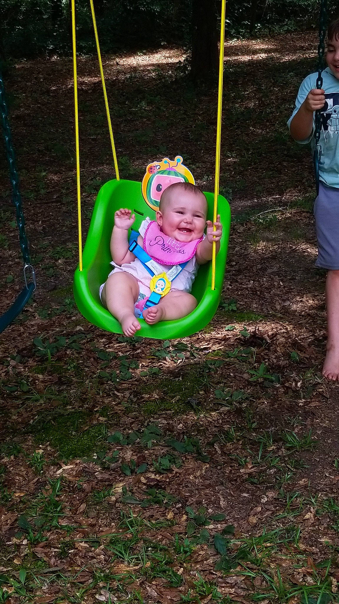 Gracelyn joined the competition — help win amazing prizes! baby, baby_toddler_clothing, city, fun, grass, happy, joy, leisure, outdoor_play_equipment, people_in_nature, person, plant, play, playground, recreation, shorts, smile, soil, swing, t_shirt