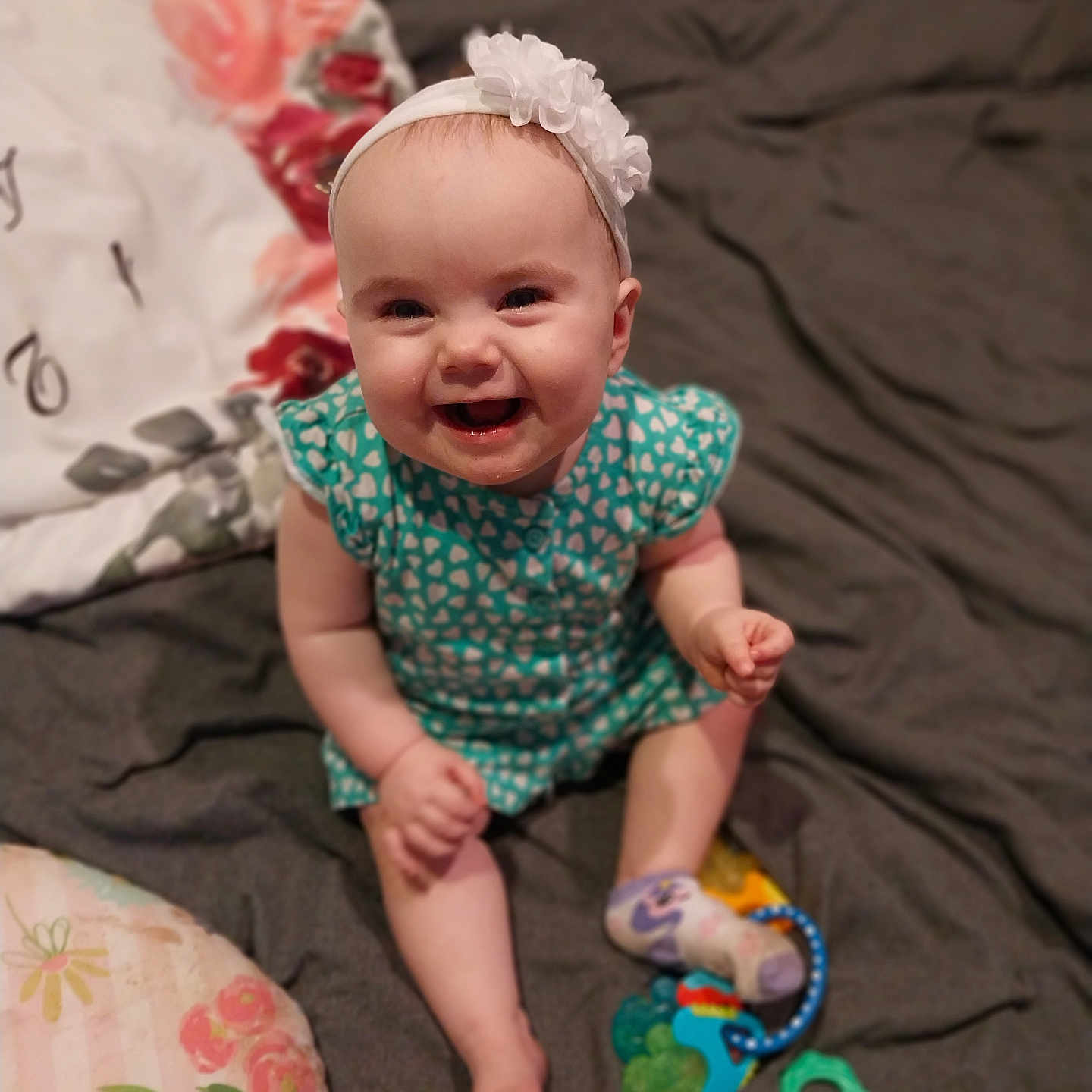 Elizabeth is registered to the contest to win money with this photo: accessories, applique, architecture, baby, babylaughing, bed, bedroom, bodypart, building, clothing, couch, cushion, dress, face, finger, furniture, hand, happy, hat, head