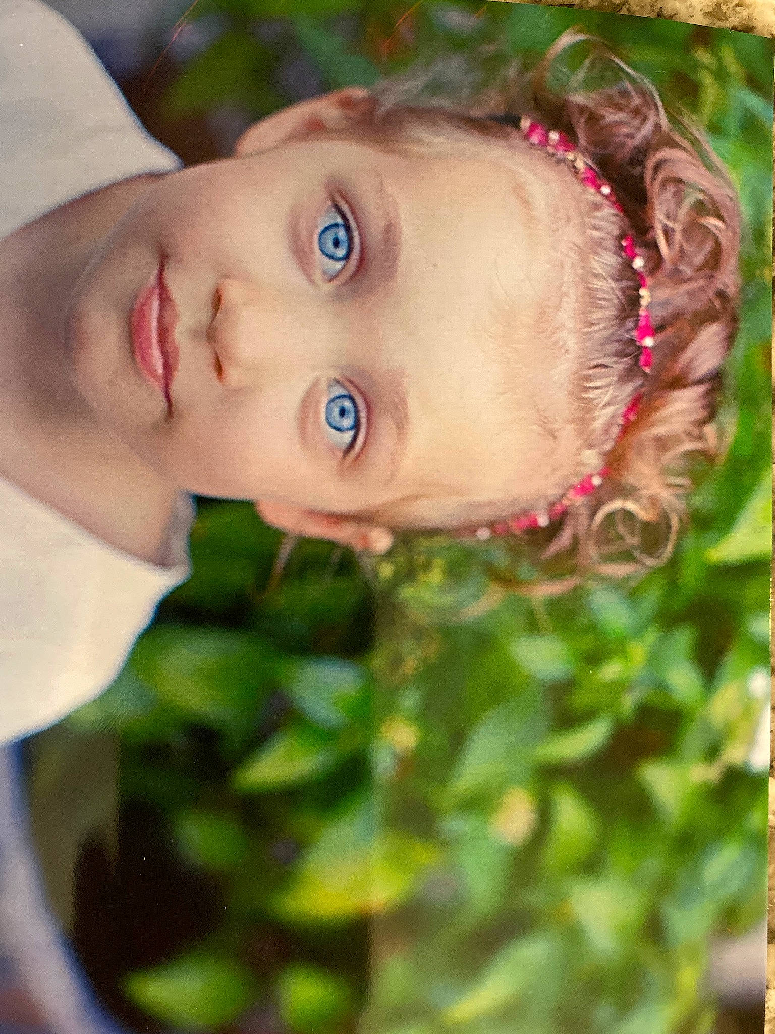 Callie is registered to the contest to win money with this photo: beauty, chin, eye, eyebrow, eyelash, face, flash_photography, grass, happy, head, iris, lip, nose, organ, people_in_nature, person, plant, skin, smile, toddler
