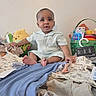 Roderick joined the competition — help win amazing prizes! baby, basket, bed, child, childrens_clothing, clothes, colorful, curious, fabric, face, foot, indoor, person, playtime, plush_toy, room, sitting, smile, toys, winnie_the_pooh