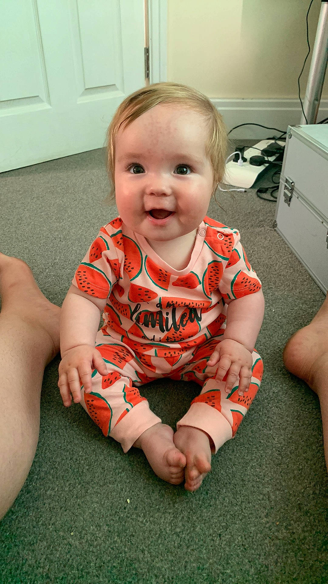 Willow-louise is registered to the contest to win money with this photo: arm, baby_toddler_clothing, cheek, chin, eye, face, facial_expression, finger, floor, flooring, hair, head, iris, joint, neck, person, shoulder, skin, sleeve, smile