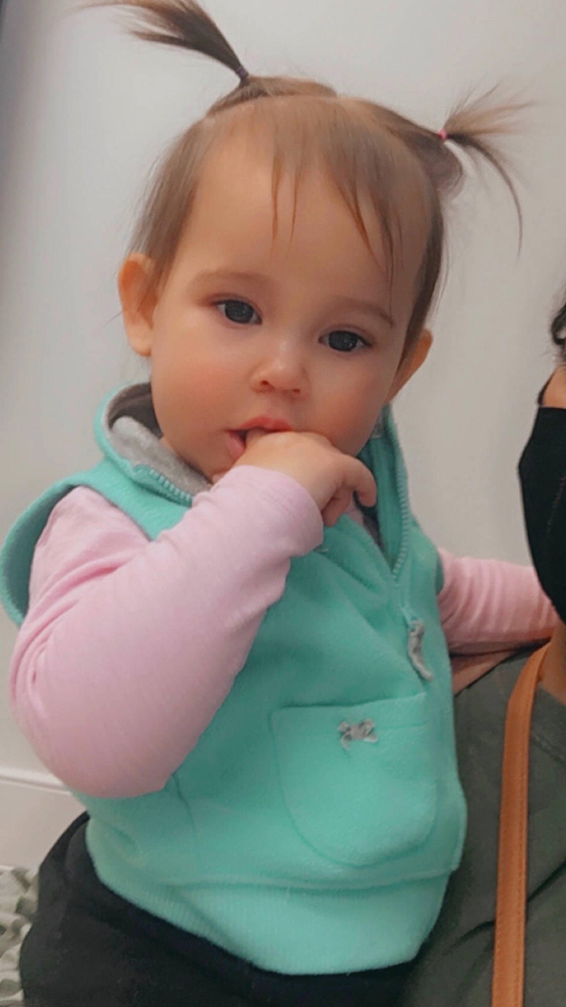 Harper is registered to the contest to win money with this photo: baby, baby_products, baby_toddler_clothing, cheek, child, comfort, elbow, eyelash, finger, fun, gesture, happy, lip, neck, nose, person, sitting, skin, sleeve, thumb