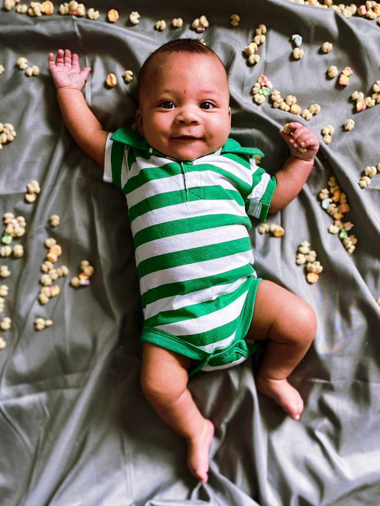 Paul is registered to the contest to win money with this photo: baby, baby_toddler_clothing, child, finger, fun, gesture, grass, happy, joy, linens, pattern, people_in_nature, person, pink, play, portrait_photography, sleeve, smile, t_shirt, textile