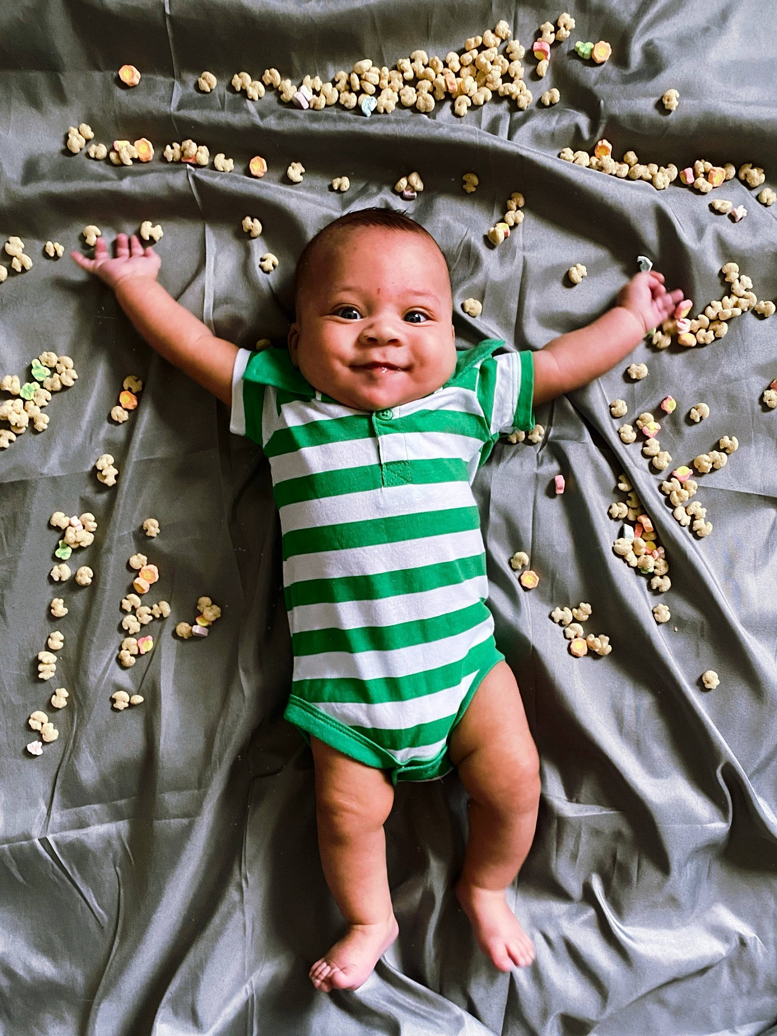 Paul is registered to the contest to win money with this photo: baby, baby_toddler_clothing, child, event, facial_expression, fashion_accessory, fun, glass, grass, happy, holiday, interior_design, joy, ornament, pattern, people_in_nature, person, play, sandal, smile
