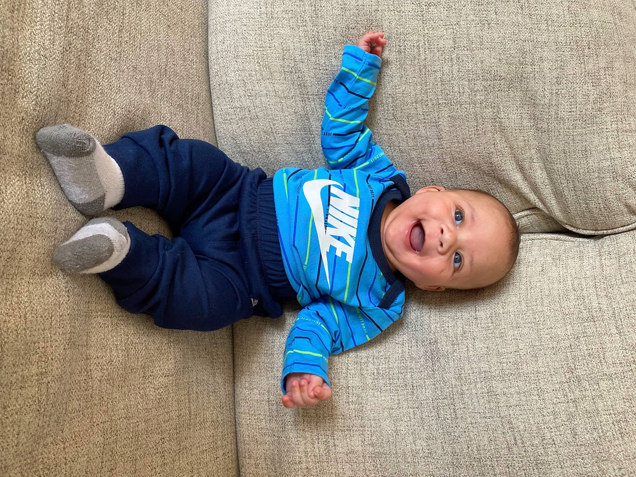 Paul is registered to the contest to win money with this photo: baby, baby_toddler_clothing, beanie, cap, child, denim, electric_blue, face, flooring, fun, grass, pattern, person, plant, portrait_photography, sitting, skin, toddler, tree, wood