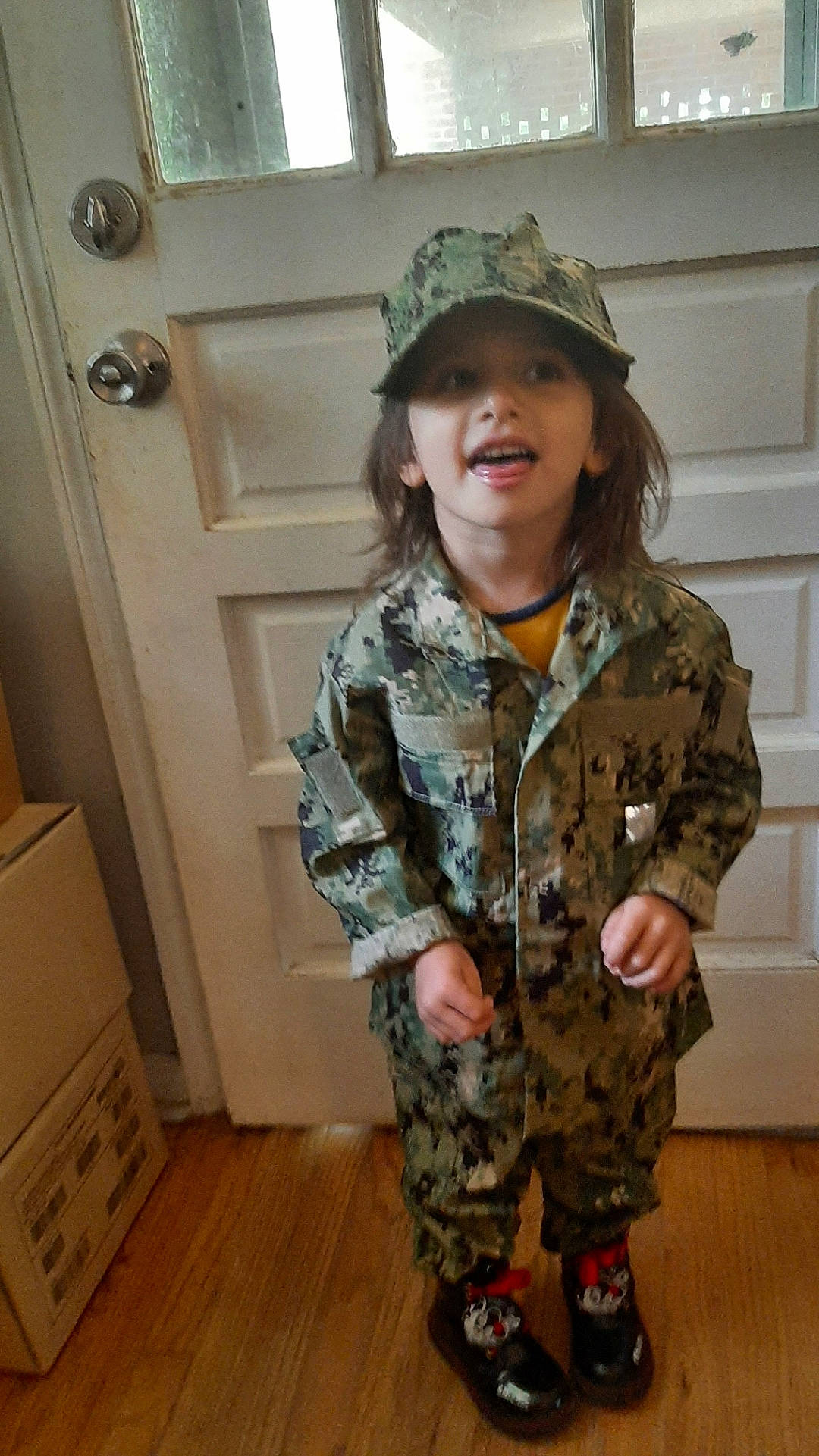 Adilynn Walker is registered to the contest to win money with this photo: army, camouflage, cap, cargo_pants, face, gesture, headgear, headwear, jacket, joint, marines, military_camouflage, military_officer, military_organization, military_person, military_uniform, non_commissioned_officer, person, sleeve, smile