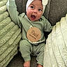 Hyacinth is registered to the contest to win money with this photo: baby, blanket, child, comfortable, cozy, cushion, cute, expression, four_months, green_clothing, happy, headband, indoor, infant, plush, portrait, sitting, smiling, soft_texture, white_bow