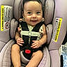 Hyacinth is registered to the contest to win money with this photo: baby, car_seat, child, infant, smile, sunglasses, pink, seatbelt, happy, cute, safety, portrait, indoors, clothing, person, headwear, small_hands, barefoot, face, seat