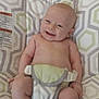baby, infant, smiling, sitting, seat, patterned, indoor, child, cute, happy, skin, bare_chest, legs, feet, hands, diaper, comfort, joy, young, childcare