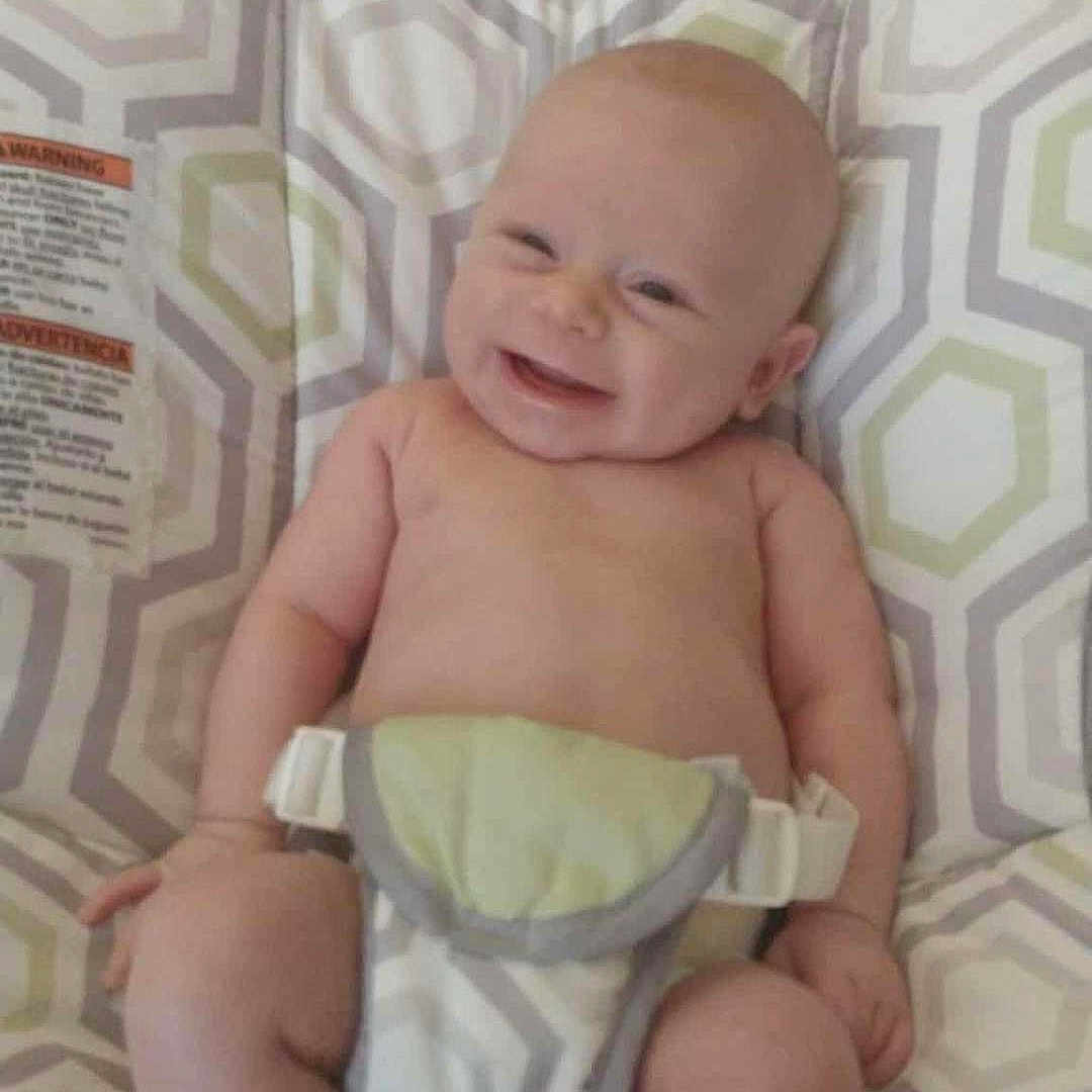 Ridian is registered to the contest to win money with this photo: baby, bare_chest, child, childcare, comfort, cute, diaper, feet, hands, happy, indoor, infant, joy, legs, patterned, seat, sitting, skin, smiling, young