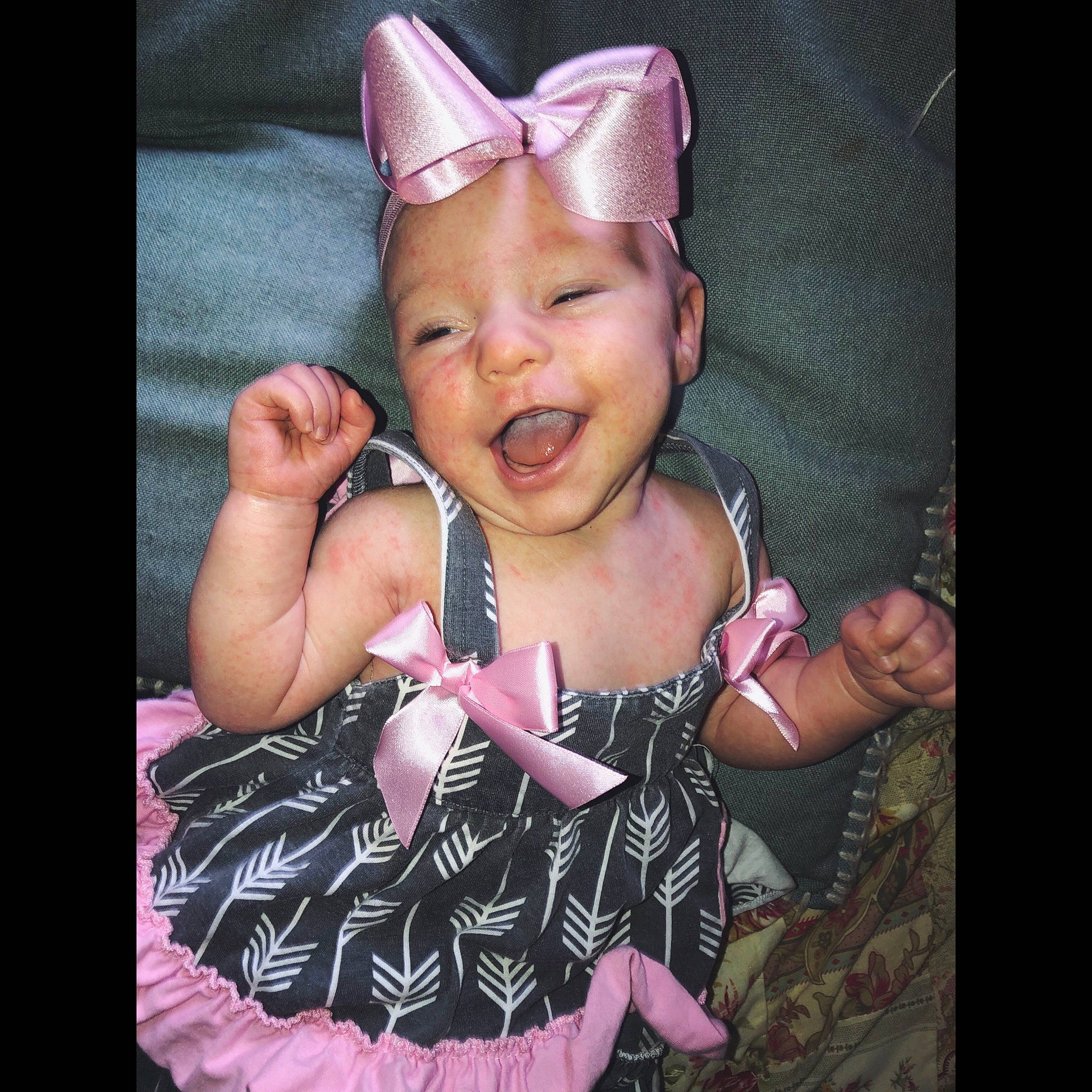 Kynsleigh is registered to the contest to win money with this photo: baby, cheek, child, cool, dress, ear, eye, face, facial_expression, happy, head, headgear, headwear, mouth, organ, person, pink, product, skin, smile