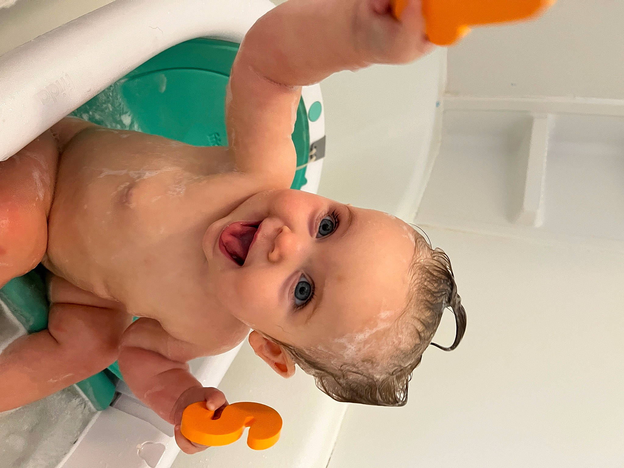 Eloise is registered to the contest to win money with this photo: baby, bathing, bathroom, cheek, chest, eyebrow, eyelash, finger, fun, happy, leisure, lip, mouth, nose, person, plumbing_fixture, skin, smile, toddler, water