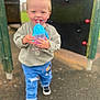 toddler, child, happy, smiling, sippy_cup, blue_eyes, sweatshirt, jeans, ripped_jeans, black_shoes, outdoor, playground, walking, person, daylight, fun, young_child, casual_clothing, cute, blond_hair