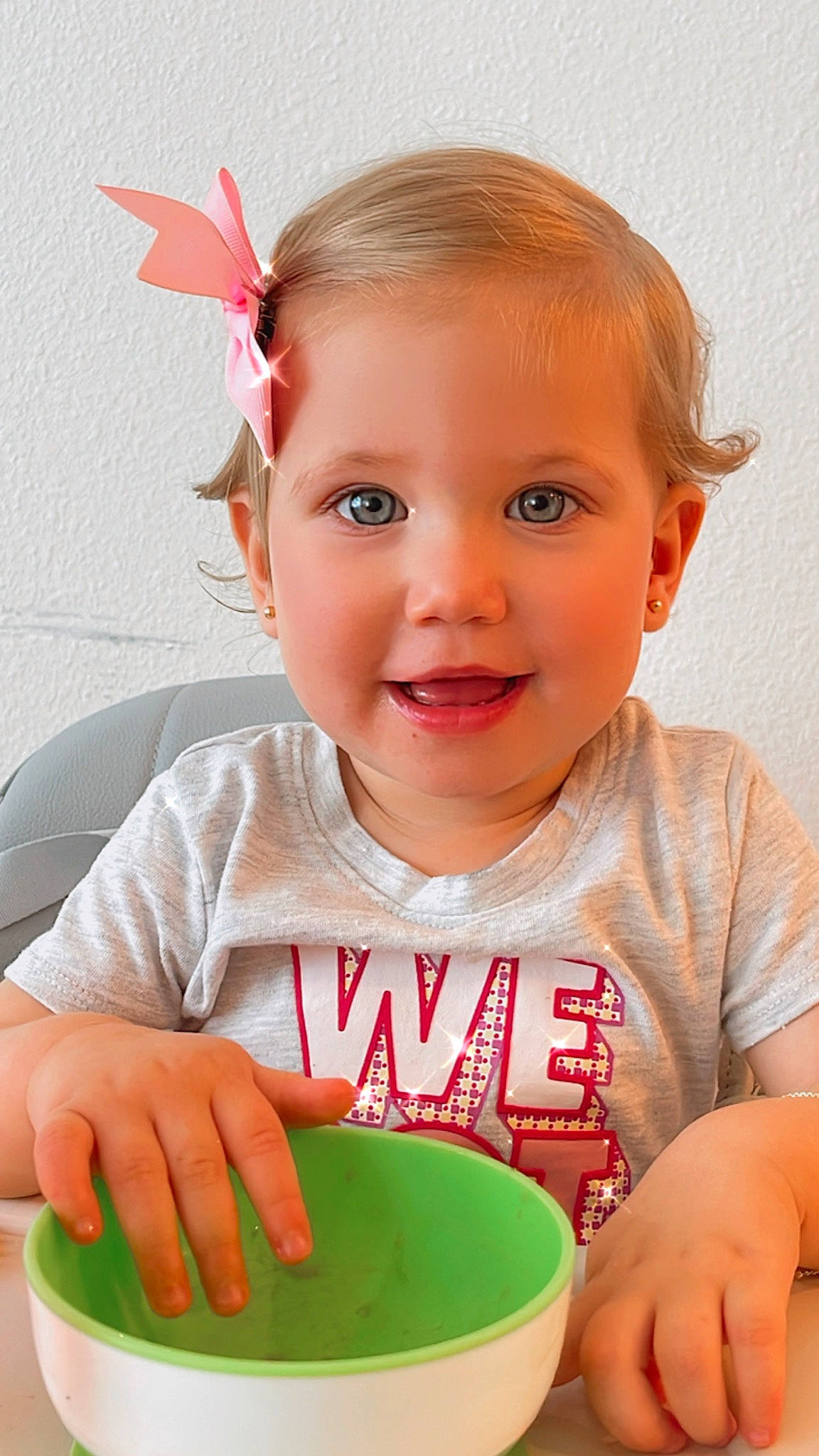 Elisa Finardi is registered to the contest to win money with this photo: baby_playing_with_toys, baby_toddler_clothing, cheek, chin, drinkware, facial_expression, finger, hand, happy, iris, joy, lip, mouth, nose, person, pink, product, skin, smile, standing
