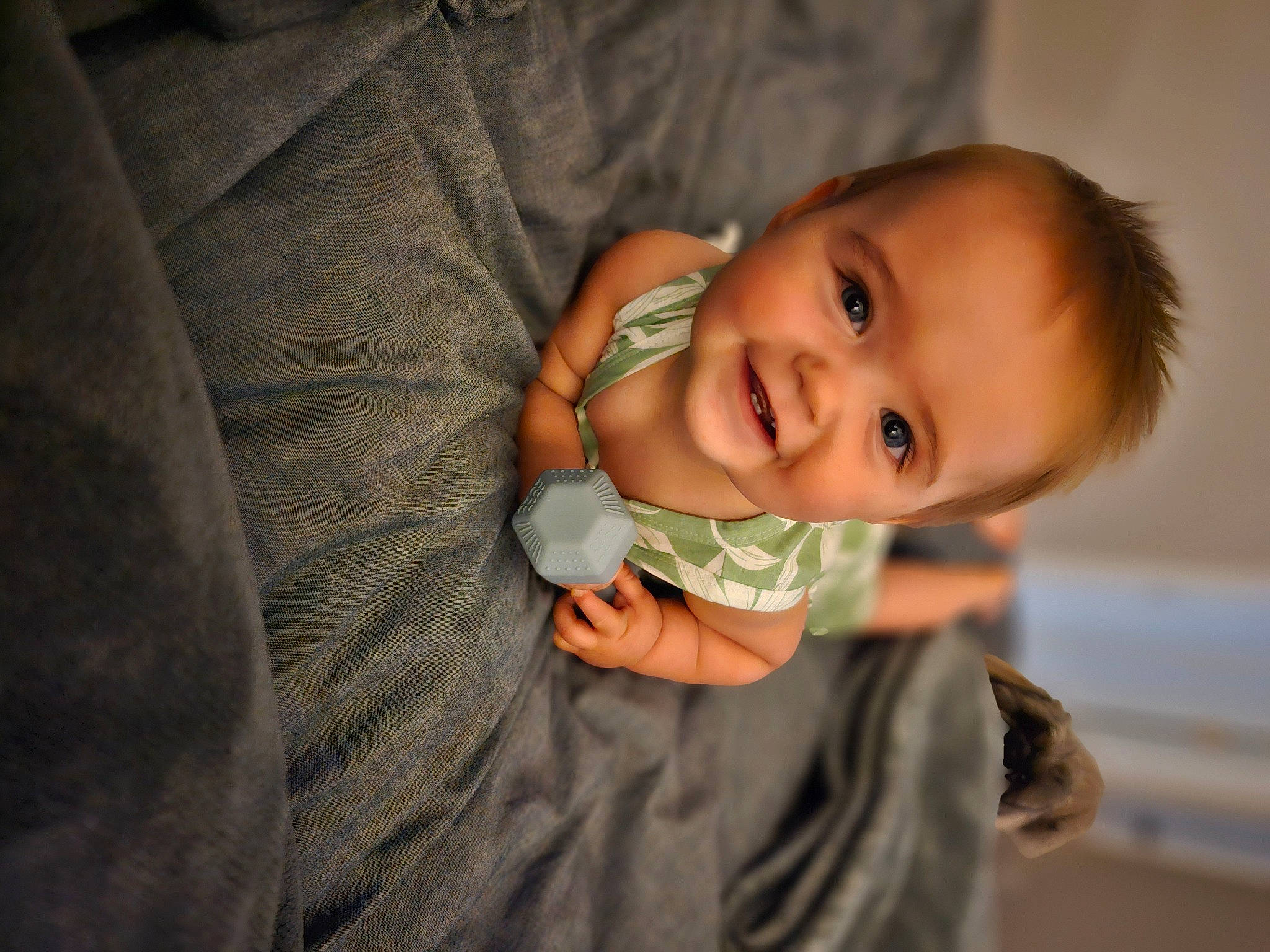 Beckham is registered to the contest to win money with this photo: arm, baby, baby_toddler_clothing, cheek, chin, comfort, finger, flash_photography, gesture, hairstyle, hand, happy, iris, joy, lip, mouth, nose, person, skin, sleeve