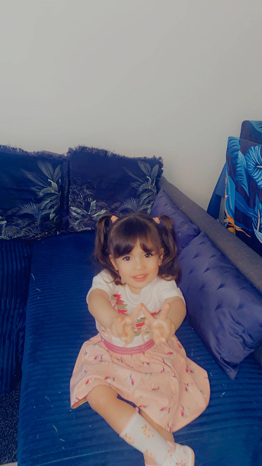 Millia participe au concours pour gagner de l'argent avec cette photo : baby_toddler_clothing, blue, child, comfort, day_dress, dress, fun, happy, human_body, human_leg, joy, leisure, linens, magenta, pattern, person, room, sitting, sleeve, textile