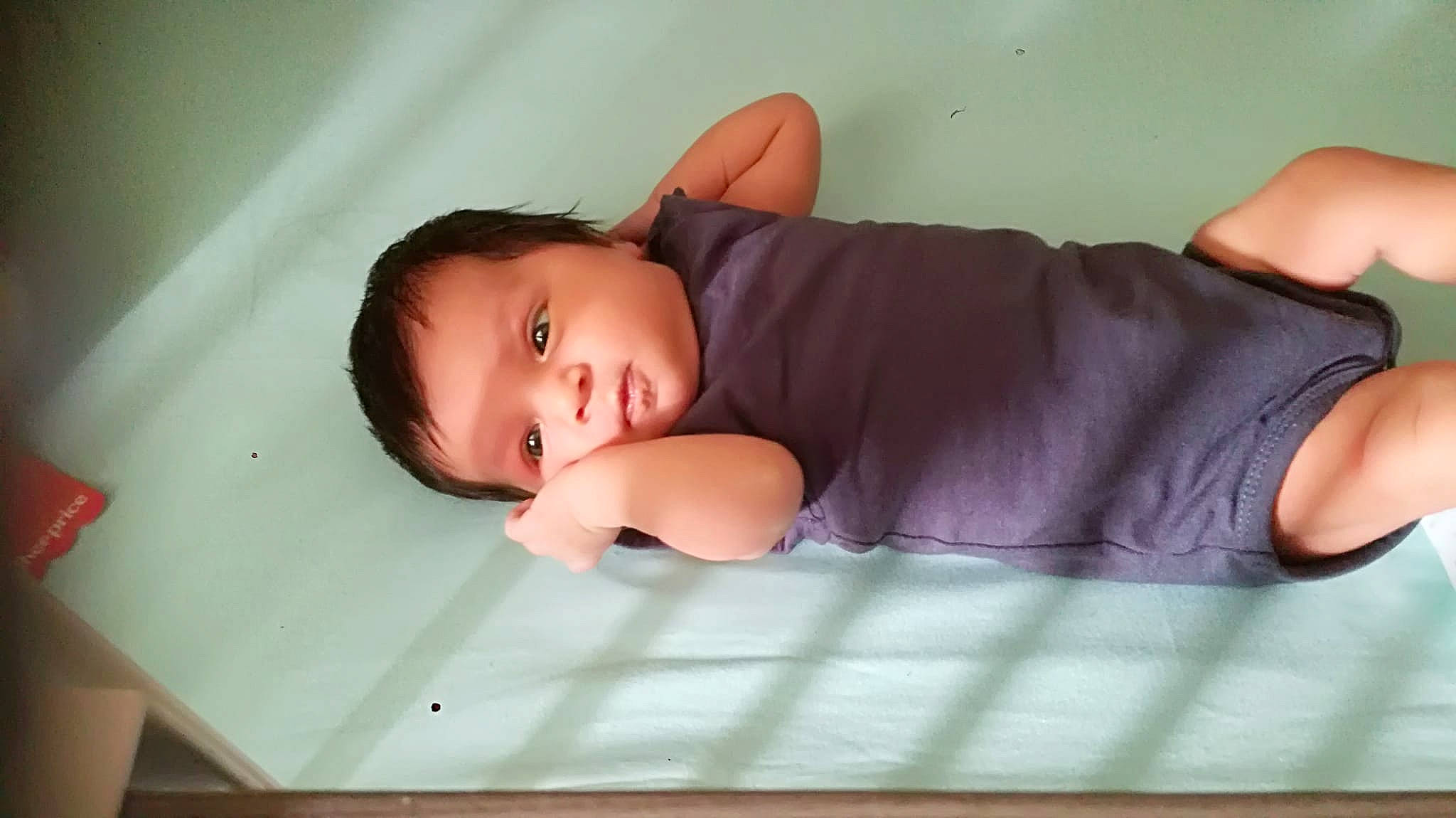 Luna participe au concours pour gagner de l'argent avec cette photo : baby, baby_toddler_clothing, bedding, cheek, child, comfort, flash_photography, flooring, hardwood, human_leg, linens, pattern, person, portrait_photography, room, sitting, skin, sleeve, toddler, wood