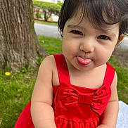 Mikelly joined the competition — help win amazing prizes! toddler, child, red_dress, bow, tongue_out, outdoor, grass, tree, cute, playful, portrait, young_child, face, skin, person, nature, summer, expression, funny, baby