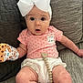 baby, bow, cat_patch, child, comfort, couch, cute, expression, furniture, headband, indoors, infant, legs, mittens, pink_clothing, polka_dots, seated, skin, soft_lighting, wide_eyes