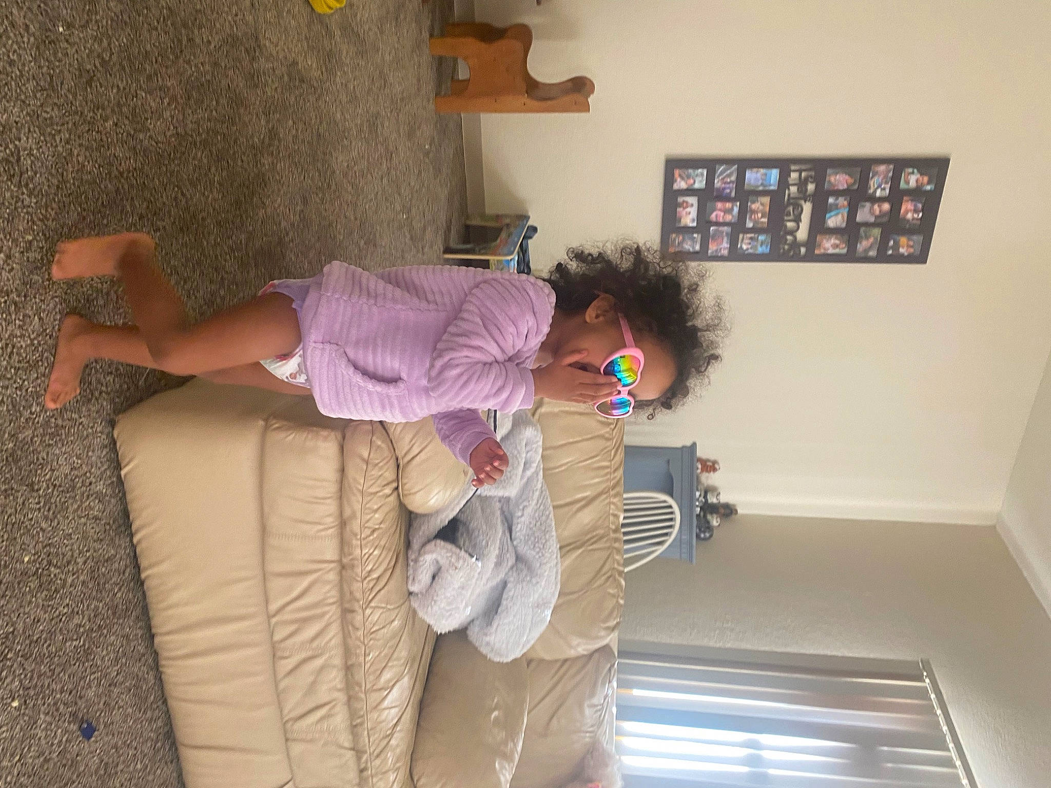 Sylvia joined the competition — help win amazing prizes! child, comfort, flooring, fun, house, human_leg, knee, person, picture_frame, plaster, purple, room, shelf, shelving, sitting, stairs, thigh, visual_arts, wall, wood