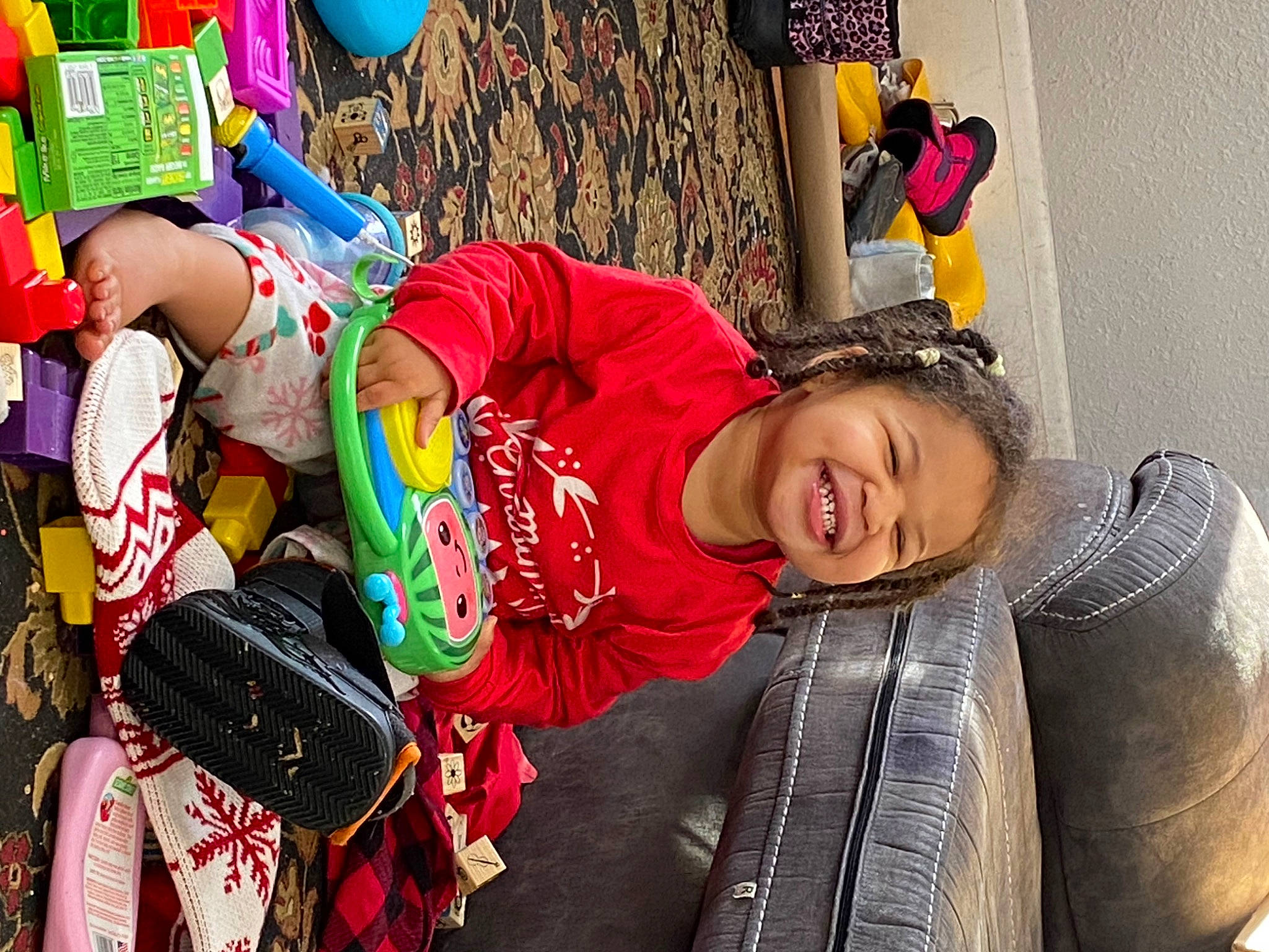 Olivia is registered to the contest to win money with this photo: bag, child, community, costume, event, fun, happy, joy, leisure, luggage_and_bags, person, public_space, recreation, shorts, smile, street, textile, toddler, tradition, tree