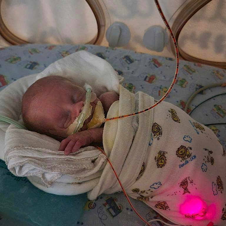 Finn joined the competition — help win amazing prizes! architecture, baby, bed, bedroom, blanket, building, clothing, cushion, face, furniture, glove, head, homedecor, hospital, indoors, newborn, person, photography, portrait, sleeping