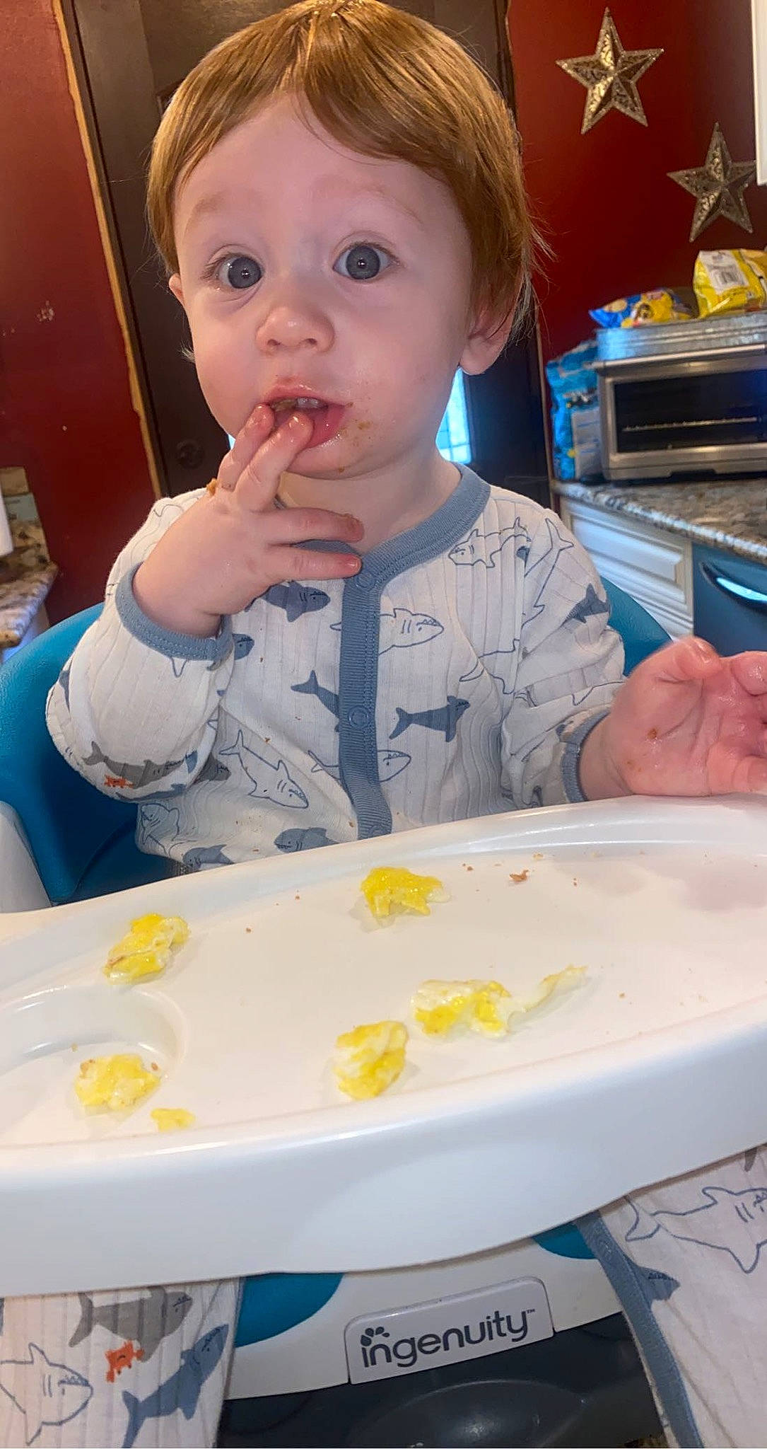 Corbett joined the competition — help win amazing prizes! baby, baby_playing_with_food, baby_toddler_clothing, biting, blue, chair, cheek, child, dishware, drinkware, food, food_craving, iris, nose, person, skin, surprise, table, tableware, toddler
