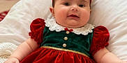 Aleksandra is registered to the contest to win money with this photo: baby, blanket, christmas, chubby_cheeks, cozy, cute, dress, face, festive, green, headband, holiday, holiday_decor, indoor, infant, person, red, smile, soft, warm