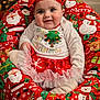 baby, bean_bag, child, christmas, christmas_tree, cute, festive, happy, headband, holiday, holiday_decor, indoor, presents, red_clothing, santa_claus, seasonal, smiling, snowman, toddler, white_clothing