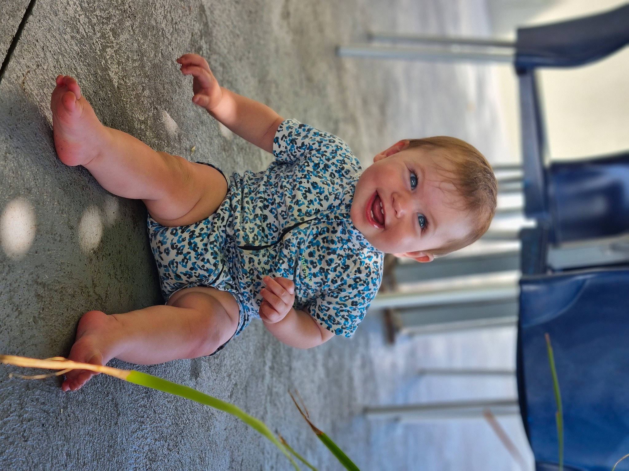 Cleo is registered to the contest to win money with this photo: baby, barefoot, child, foot, fun, grass, happy, human_leg, joint, joy, knee, leg, leisure, people, people_in_nature, person, sitting, smile, summer, thigh