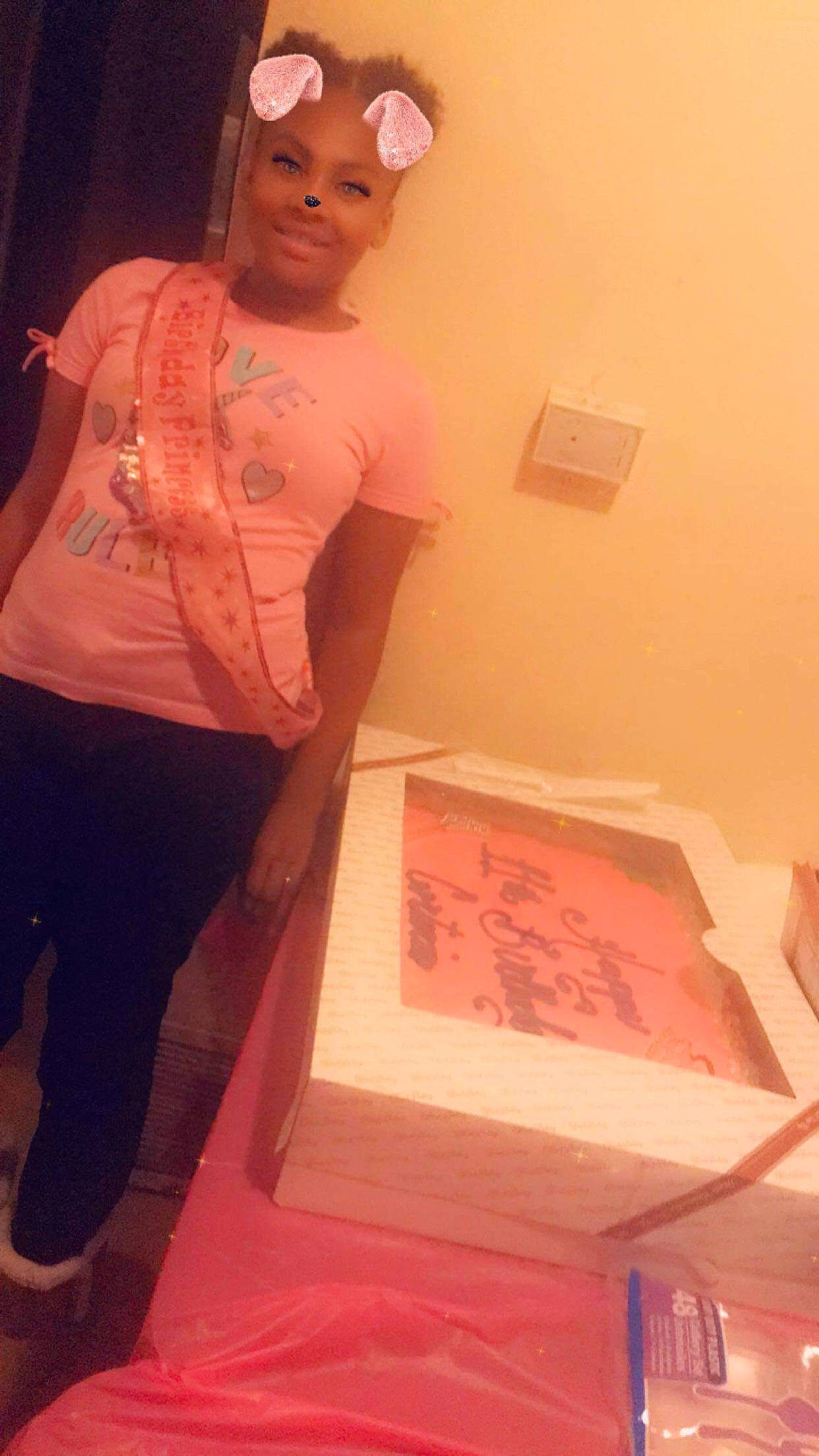 Corteria is registered to the contest to win money with this photo: art, cap, fashion_design, flesh, flooring, font, fun, headwear, jewellery, joy, magenta, necklace, paper, peach, person, pink, plaster, room, sleeve, smile